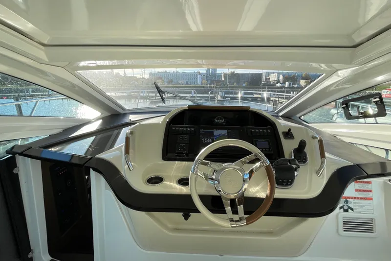 Slide: The Image of 2018 Benetau Gran Turismo 40 helm with modern controls and panoramic view. - 14