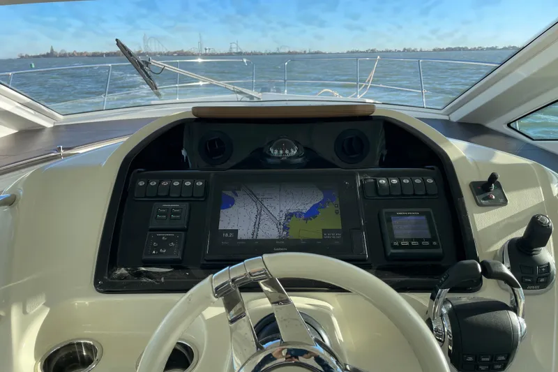 Slide: The Image of 2018 Benetau Gran Turismo 40 helm with navigation display on open water. - 15