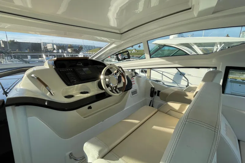Slide: The Image of Interior of 2018 Benetau Gran Turismo 40 yacht, featuring modern helm and seating. - 18