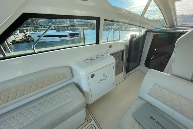 Slide: The Image of Interior of 2018 Benetau Gran Turismo 40 yacht with elegant seating and waterfront view. - 21
