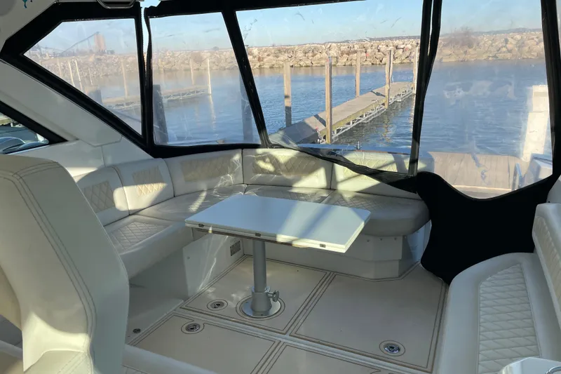 Slide: The Image of Interior of 2018 Benetau Gran Turismo 40 yacht with seating and table, dockside view. - 22