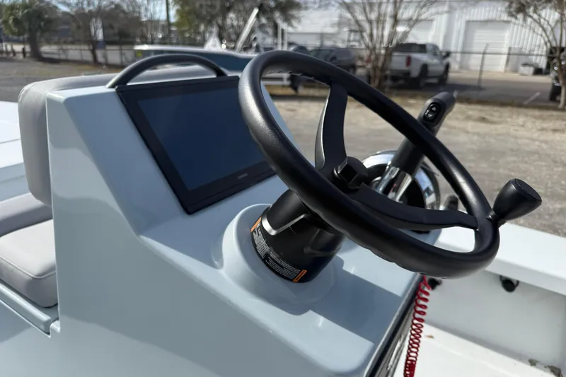 Slide: The Image of 2025 East Cape Vantage boat steering console with touchscreen display and control features. - 6