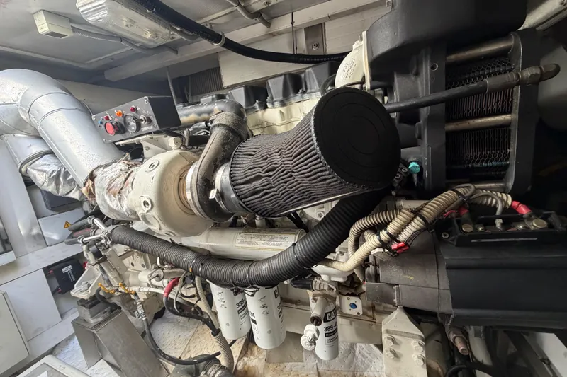 Slide: The Image of Engine room of a 2007 Azimut 62S yacht, showcasing detailed mechanical components. - 10