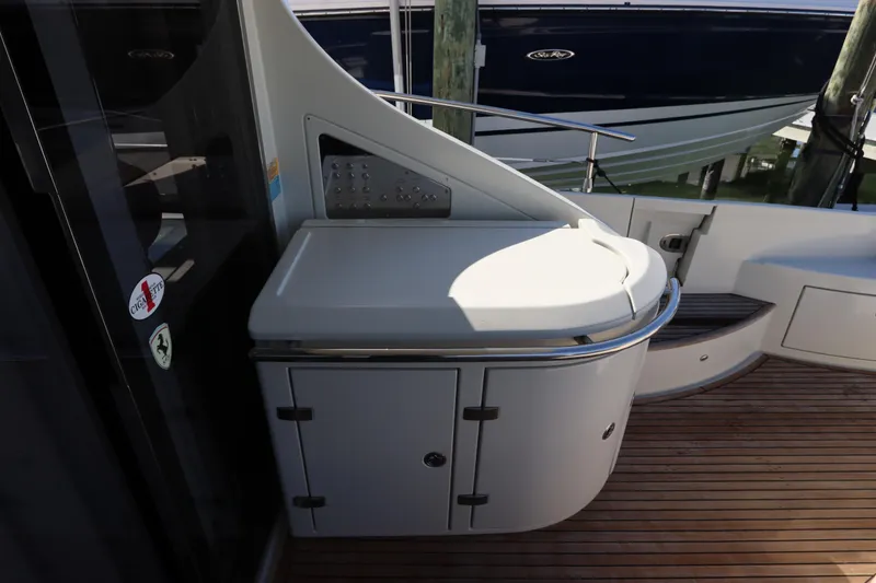 Slide: The Image of 2007 Azimut 62S yacht deck with sleek cabinetry and wooden flooring. - 11