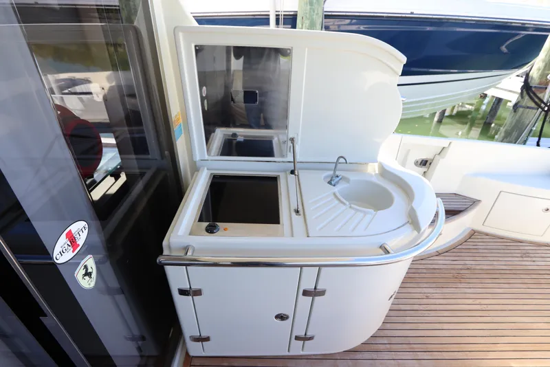 Slide: The Image of Outdoor kitchenette on 2007 Azimut 62S yacht with sink and storage. - 12