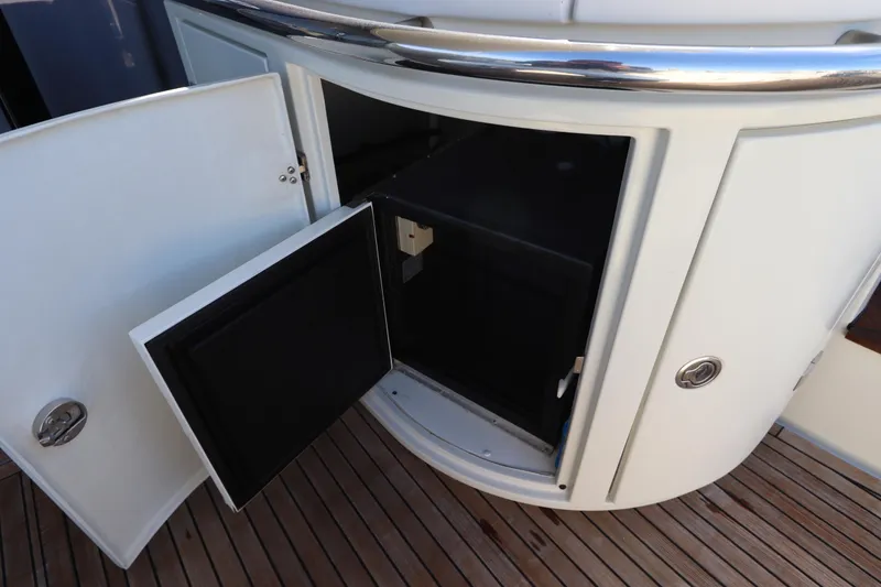 Slide: The Image of Open storage compartment on 2007 Azimut 62S yacht with wooden deck. - 14