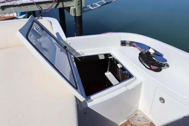 Slide: The Image of Open storage compartment on 2007 Azimut 62S yacht, docked by calm water. - 16