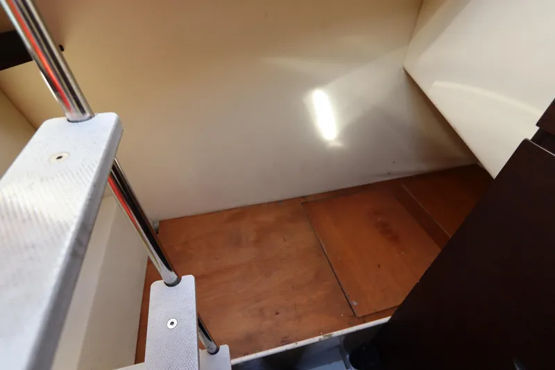 Slide: The Image of Interior view of 2007 Azimut 62S yacht showing wooden flooring and metal stairs. - 18