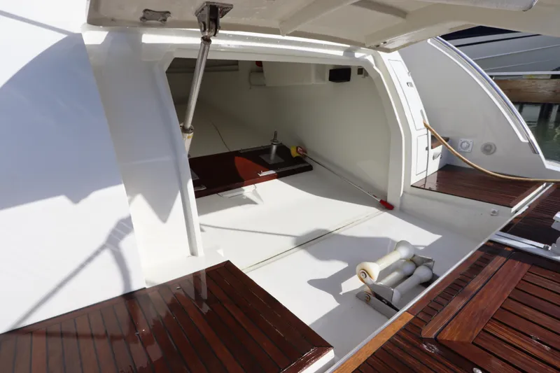Slide: The Image of Open storage compartment on 2007 Azimut 62S yacht with wooden deck details. - 2