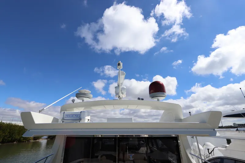 Slide: The Image of 2007 Azimut 62S yacht with clear blue sky and rescue pod. - 25