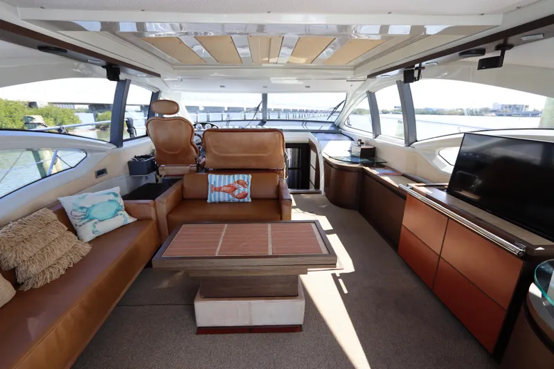 Slide: The Image of Luxurious interior of a 2007 Azimut 62S yacht with elegant seating and modern amenities. - 27