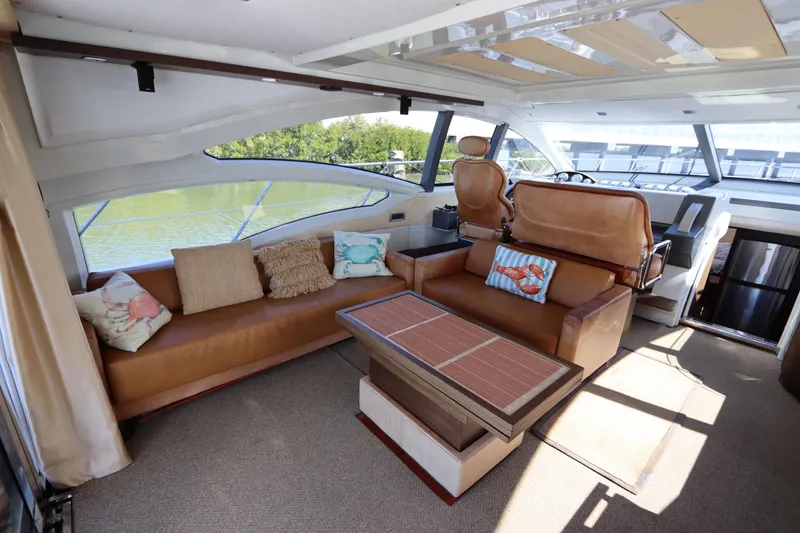 Slide: The Image of Luxurious interior of a 2007 Azimut 62S yacht with elegant seating and decor. - 28