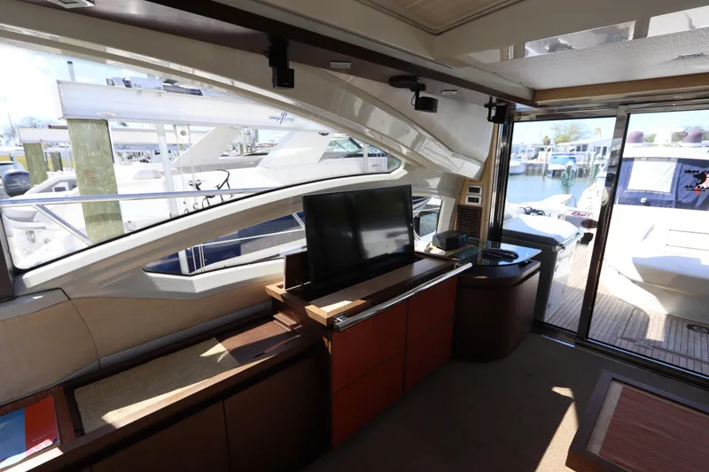 Slide: The Image of Interior of 2007 Azimut 62S yacht with modern furnishings and marina view. - 29