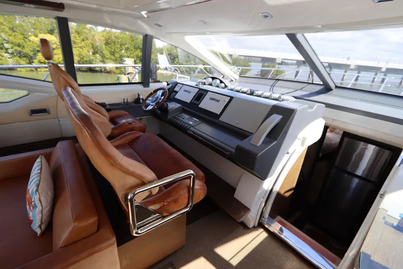 Slide: The Image of Luxurious interior of 2007 Azimut 62S yacht with leather seating and modern helm. - 32