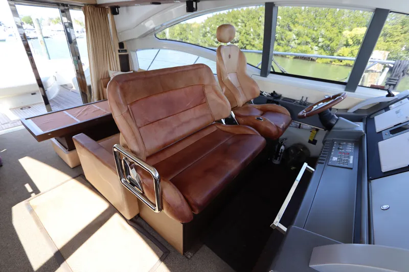 Slide: The Image of Interior of 2007 Azimut 62S yacht with leather seating and modern dashboard. - 33