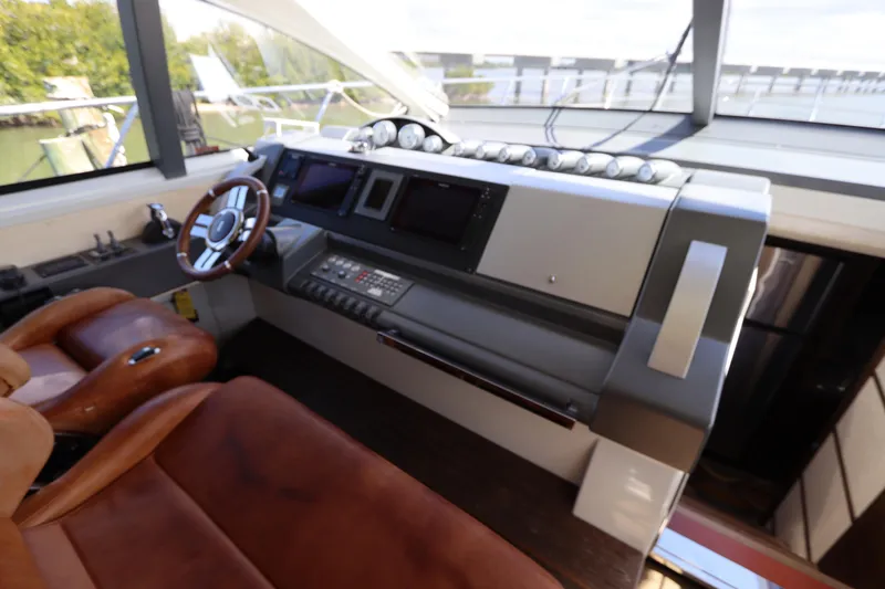 Slide: The Image of Cockpit of 2007 Azimut 62S yacht with leather seating and modern controls. - 34