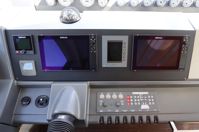 Slide: The Image of Control panel of a 2007 Azimut 62S yacht with Simrad navigation displays. - 36