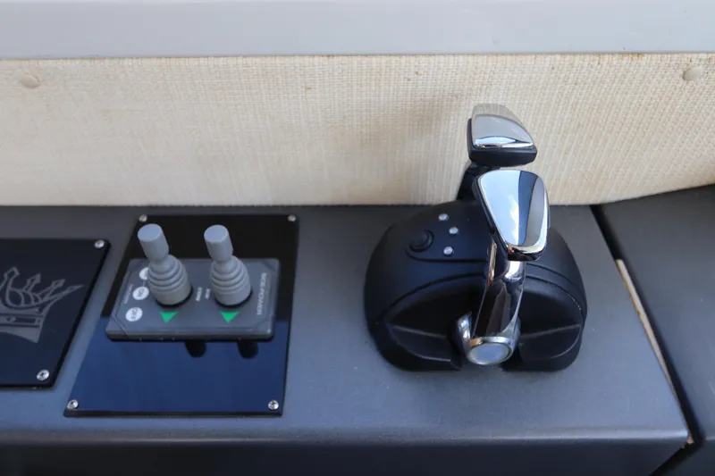 Slide: The Image of Control panel of a 2007 Azimut 62S yacht with throttle and joystick. - 38