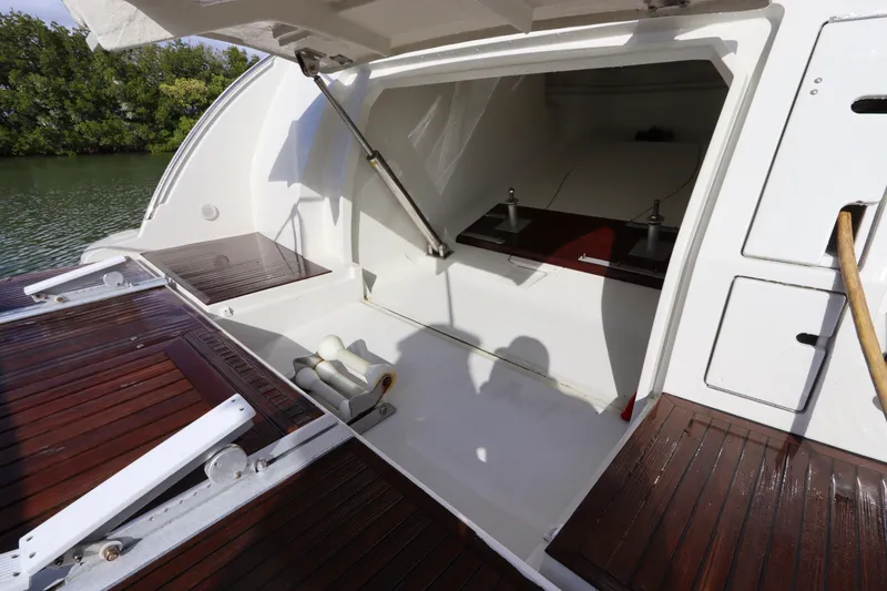 Slide: The Image of 2007 Azimut 62S yacht with open storage compartment and wooden deck details. - 4