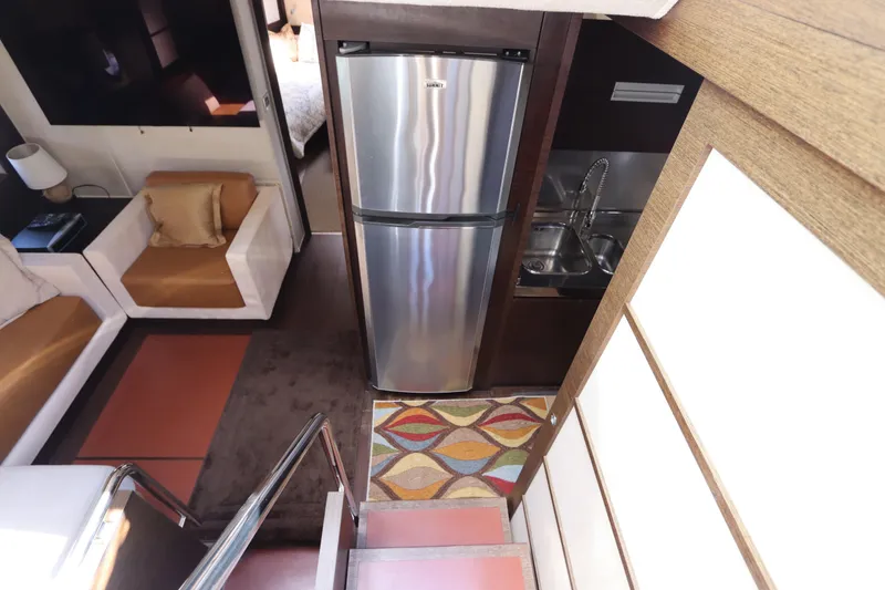 Slide: The Image of Interior of 2007 Azimut 62S yacht with kitchen and seating area. - 40