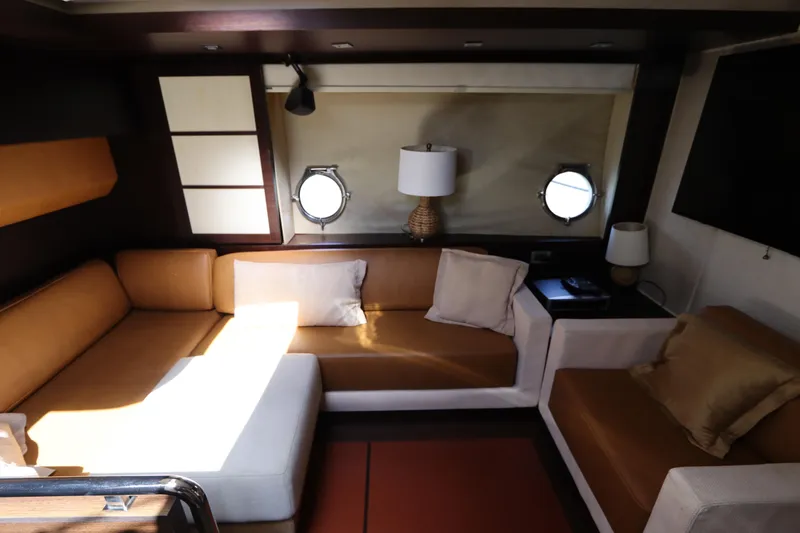 Slide: The Image of Luxurious interior of 2007 Azimut 62S yacht with elegant seating and porthole windows. - 41