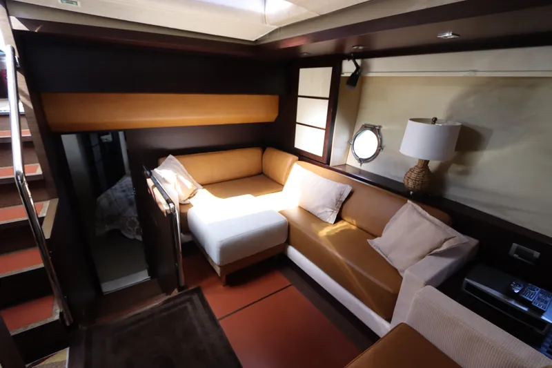 Slide: The Image of Luxurious interior of a 2007 Azimut 62S yacht with cozy seating and elegant decor. - 42