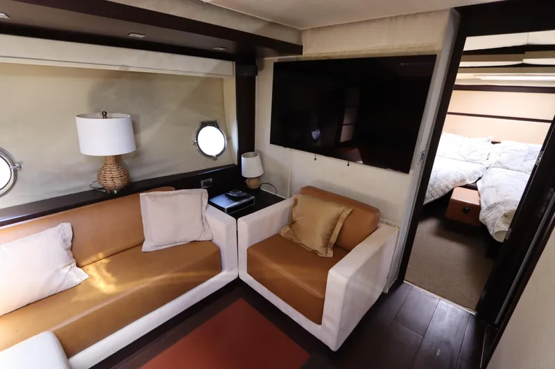 Slide: The Image of Luxurious interior of a 2007 Azimut 62S yacht with cozy seating and modern decor. - 43