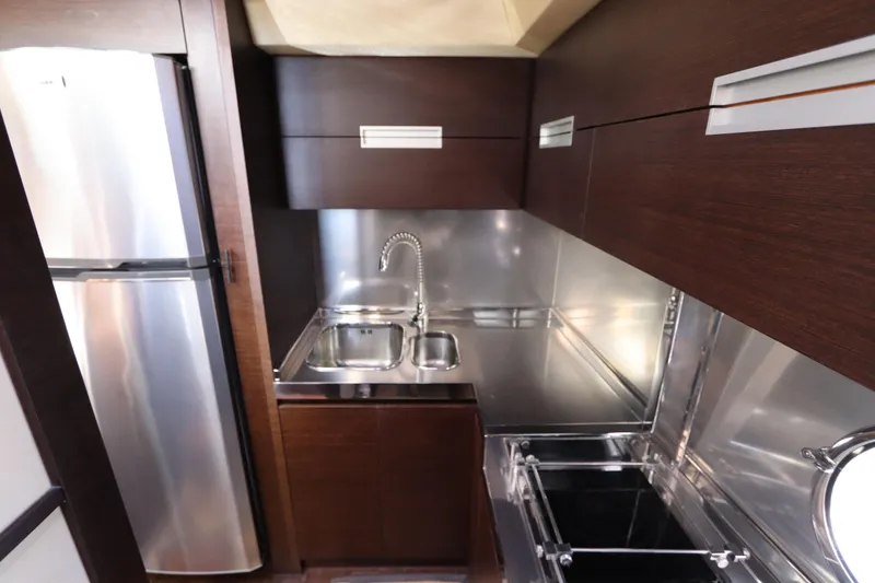 Slide: The Image of Luxurious kitchen interior of 2007 Azimut 62S yacht with modern appliances and sleek design. - 46
