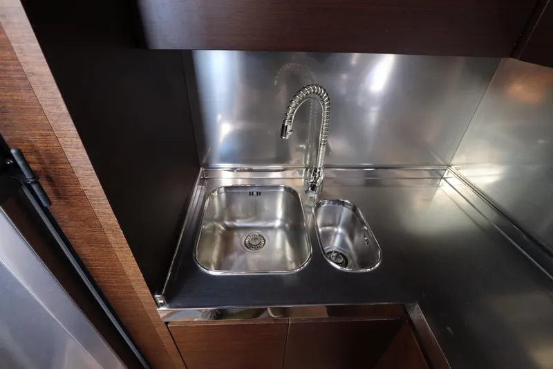Slide: The Image of Luxury yacht kitchen sink in 2007 Azimut 62S, featuring sleek stainless steel design. - 47