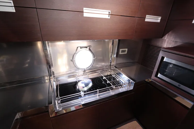 Slide: The Image of Luxurious kitchen in 2007 Azimut 62S yacht with modern appliances and sleek design. - 48