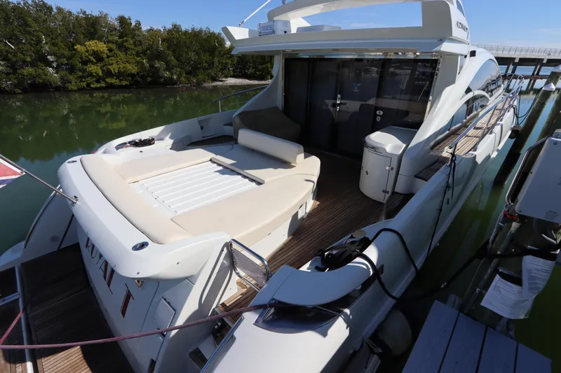 Slide: The Image of Luxury 2007 Azimut 62S yacht docked, featuring spacious deck and sleek design. - 5