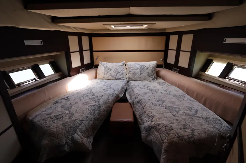 Slide: The Image of Luxurious 2007 Azimut 62S yacht cabin with twin beds and elegant decor. - 52