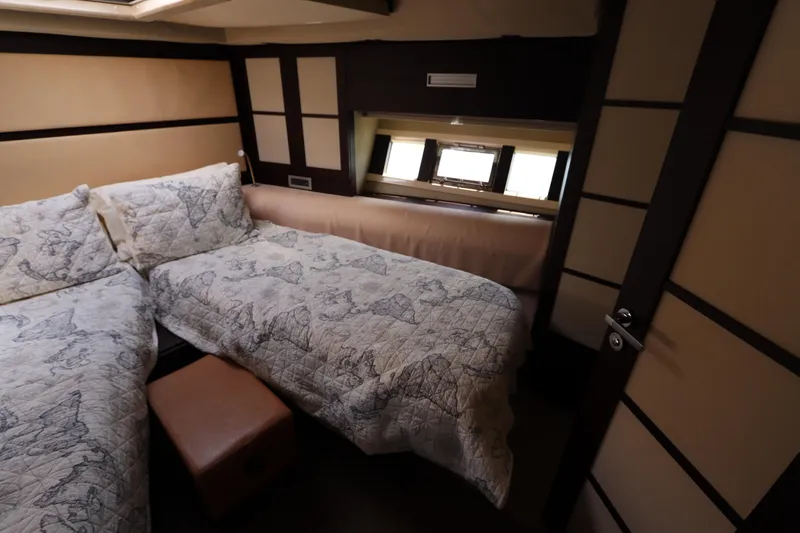 Slide: The Image of Luxurious cabin interior of 2007 Azimut 62S yacht with twin beds and elegant decor. - 53