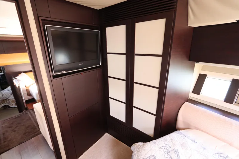 Slide: The Image of Interior of 2007 Azimut 62S yacht with TV and modern design elements. - 57