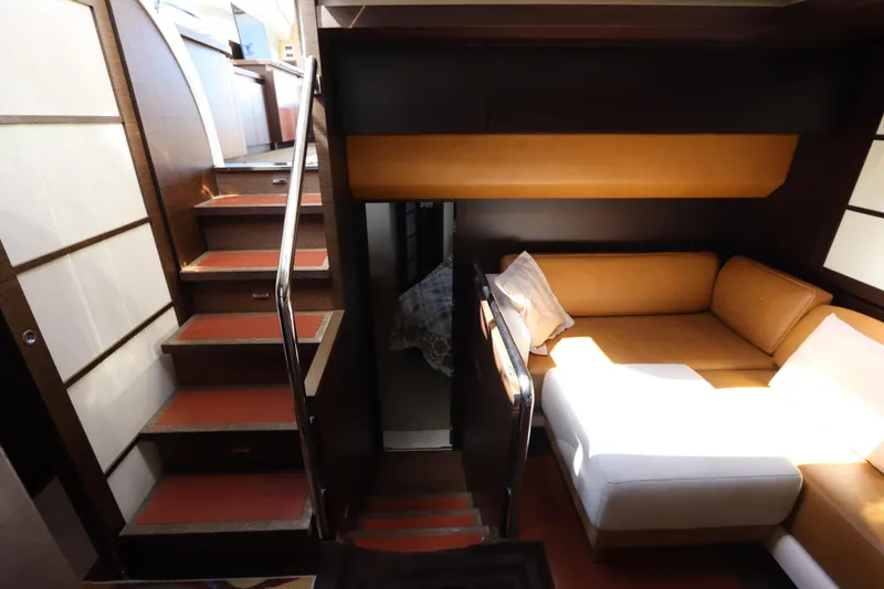 Slide: The Image of Interior of 2007 Azimut 62S yacht with stairs and cozy seating area. - 61