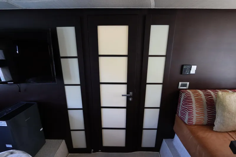 Slide: The Image of Interior of 2007 Azimut 62S yacht with modern door and TV setup. - 64