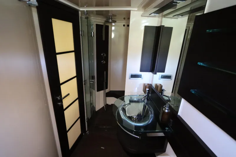 Slide: The Image of Luxurious bathroom interior of 2007 Azimut 62S yacht with modern fixtures and glass sink. - 68
