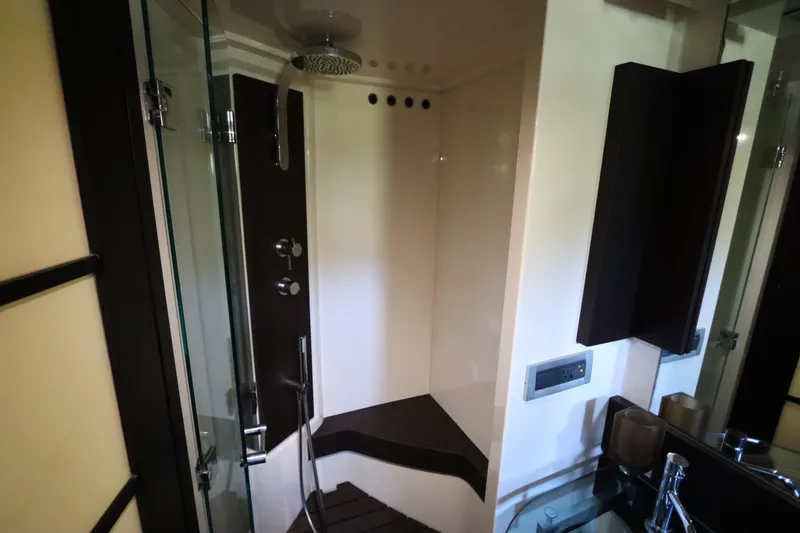 Slide: The Image of Luxurious shower area in a 2007 Azimut 62S yacht, featuring modern fixtures and sleek design. - 69
