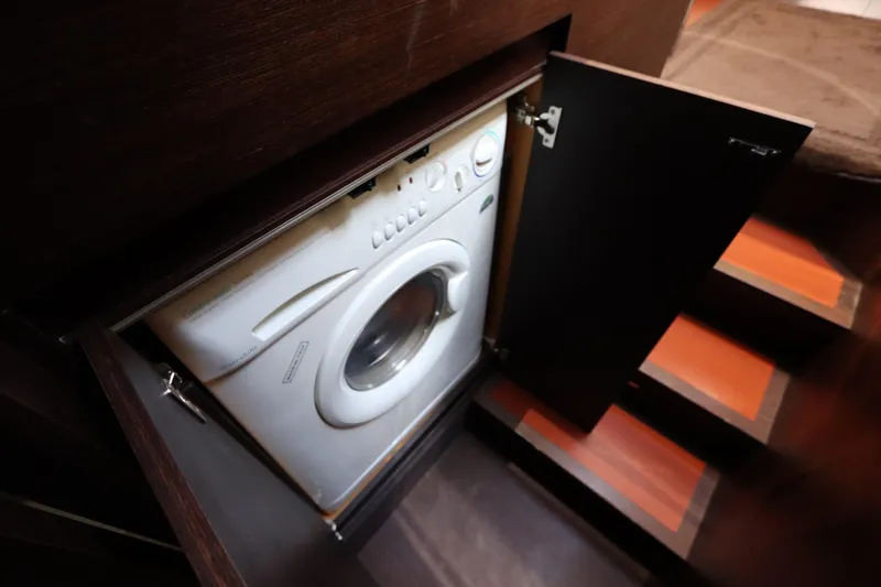 Slide: The Image of Washing machine in 2007 Azimut 62S yacht, hidden behind wooden cabinet doors. - 70