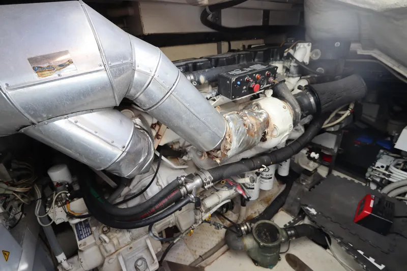 Slide: The Image of Engine room of a 2007 Azimut 62S yacht, showcasing mechanical components and ductwork. - 9