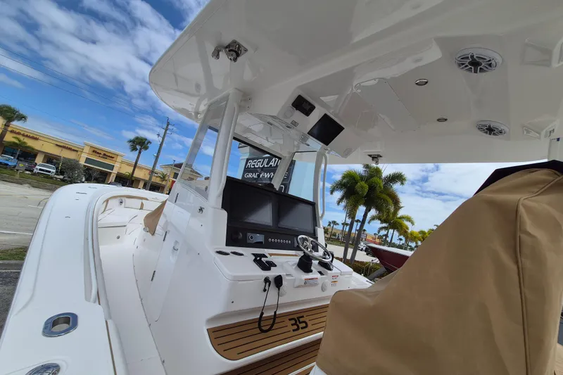 Slide: The Image of Regulator 35 boat 2026 with modern helm console and blue sky. - 15