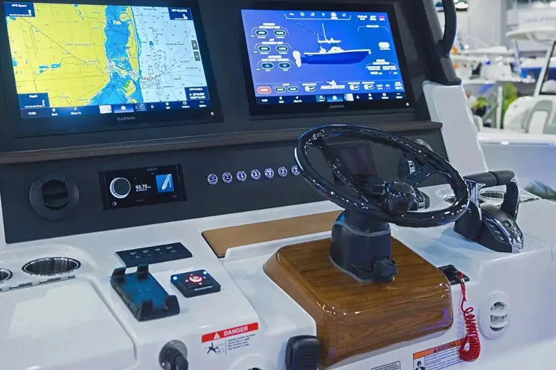 Slide: The Image of Manufacturer Provided Image: Helm of 2026 Regulator 35 boat with advanced navigation displays and controls. - 4