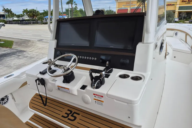 Slide: The Image of Regulator 35 boat console 2026 with steering and screens. - 9