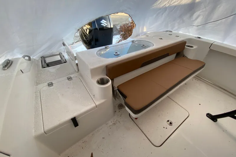 Slide: The Image of 2025 Sea Pro 222 Center Console boat interior with seating and storage compartments. - 3