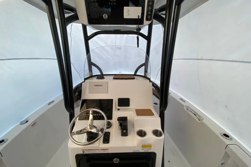 Slide: The Image of 2025 Sea Pro 222 Center Console boat interior with steering wheel and controls. - 6