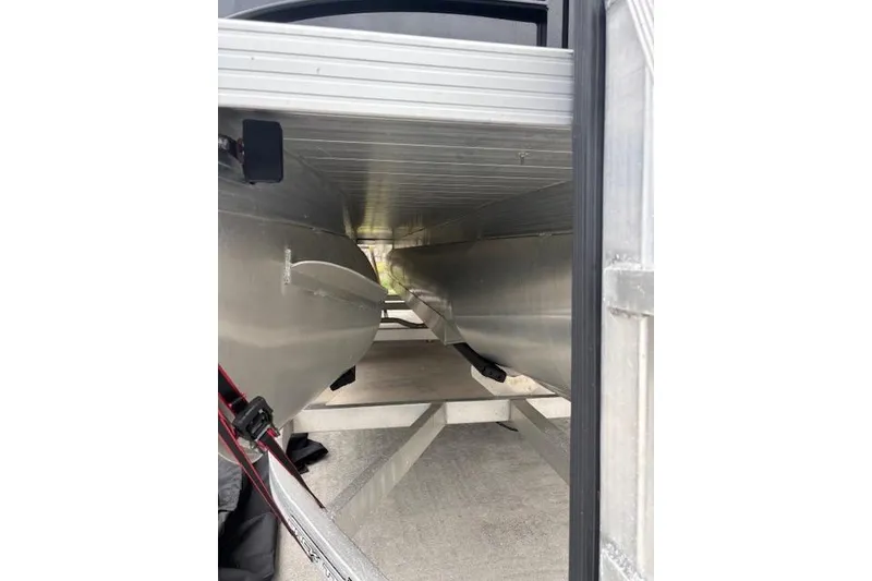 Slide: The Image of Underneath view of a 2022 Veranda Vista 22RC pontoon boat on a trailer. - 13