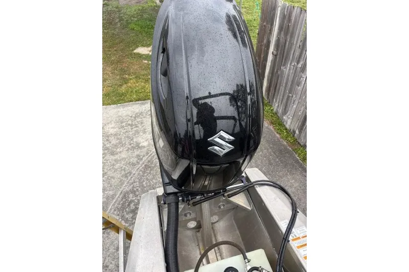 Slide: The Image of Black Suzuki outboard motor on a 2022 Veranda Vista 22RC boat. - 16