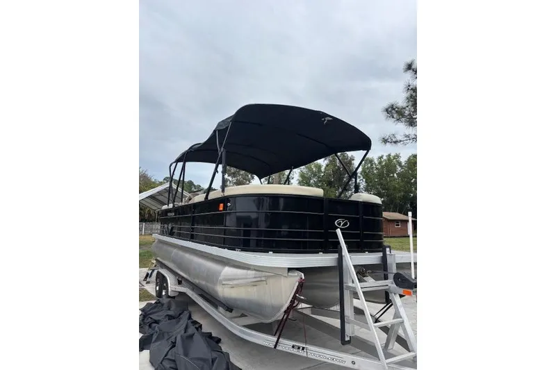Slide: The Image of 2022 Veranda Vista 22RC pontoon boat with canopy on trailer. - 2