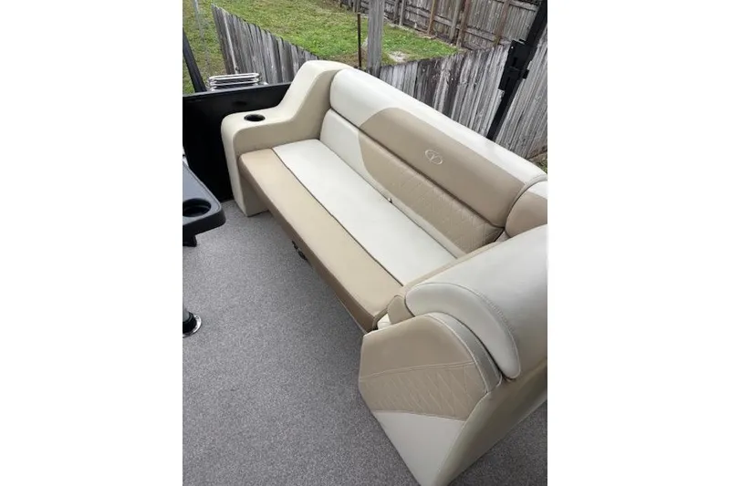 Slide: The Image of 2022 Veranda Vista 22RC boat interior with beige and cream seating. - 21