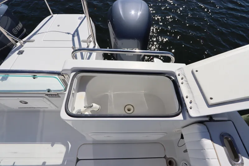 Slide: The Image of 2008 Glacier Bay 3080 Coastal Runner boat with open storage compartment and Yamaha engines. - 19